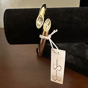 “Jessica Simpson” Gold Bangle Bracelet with Crystal Accents